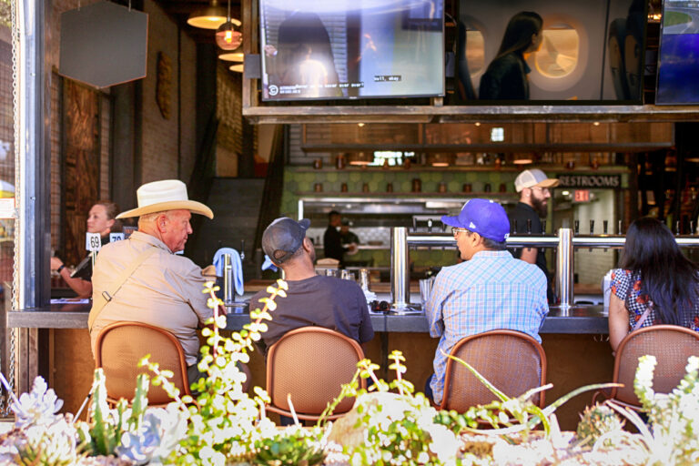 People enjoying the atmosphere at the Tenn55 Brewing & Sausage House on E Congress St in downtown Tucson AZ TV for restaurant