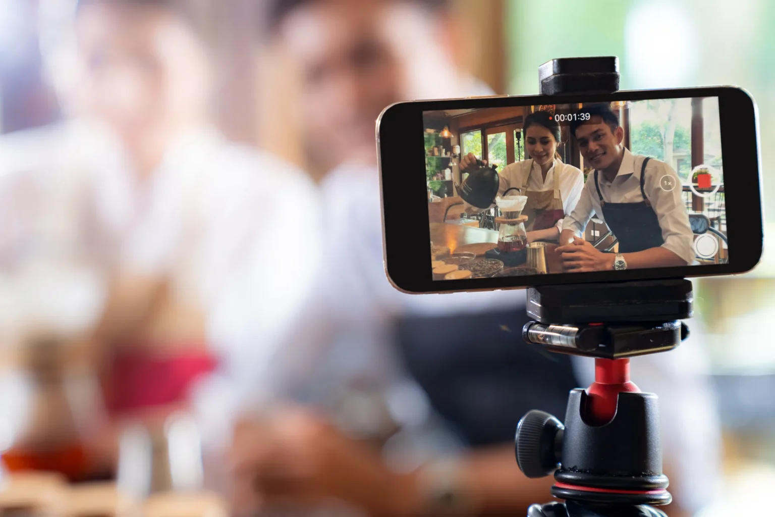 VLOG of young adult asian owner entrepreneur review cafe coffee shop and live in social media for online marketing with smart phone in cafe. Using for startup of small business maketing and consumerism concept. Social media food trends