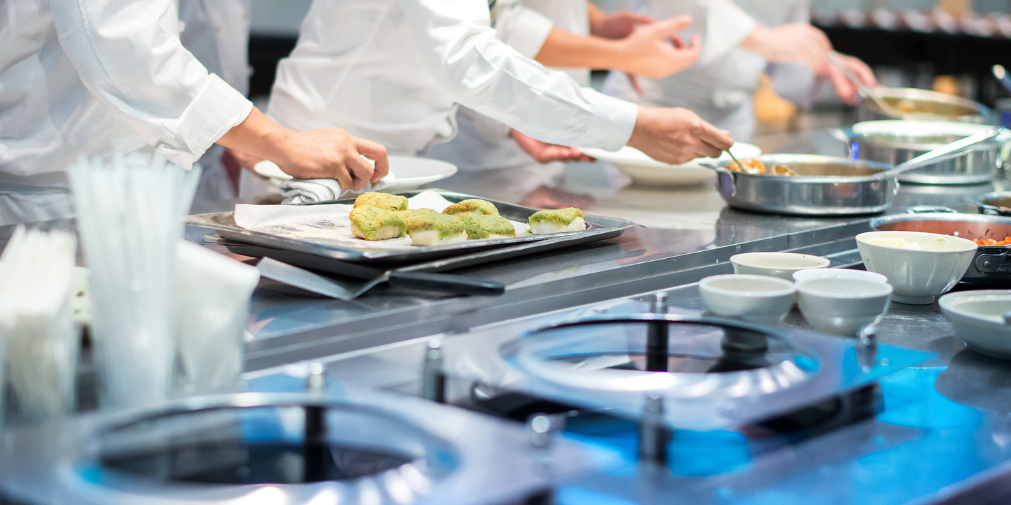 Team of fine dinnig restaurant chef helping each other to finish the good food for customer in five star hotel