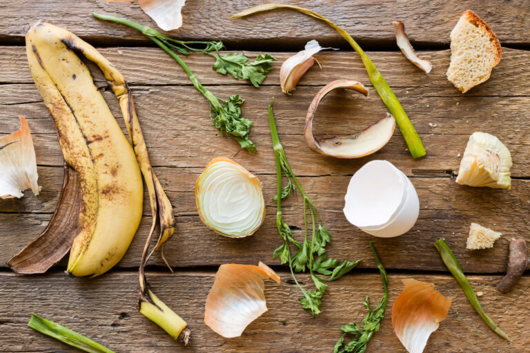 Food waste and leftovers on a wooden background. How to reduce food waste in restaurants