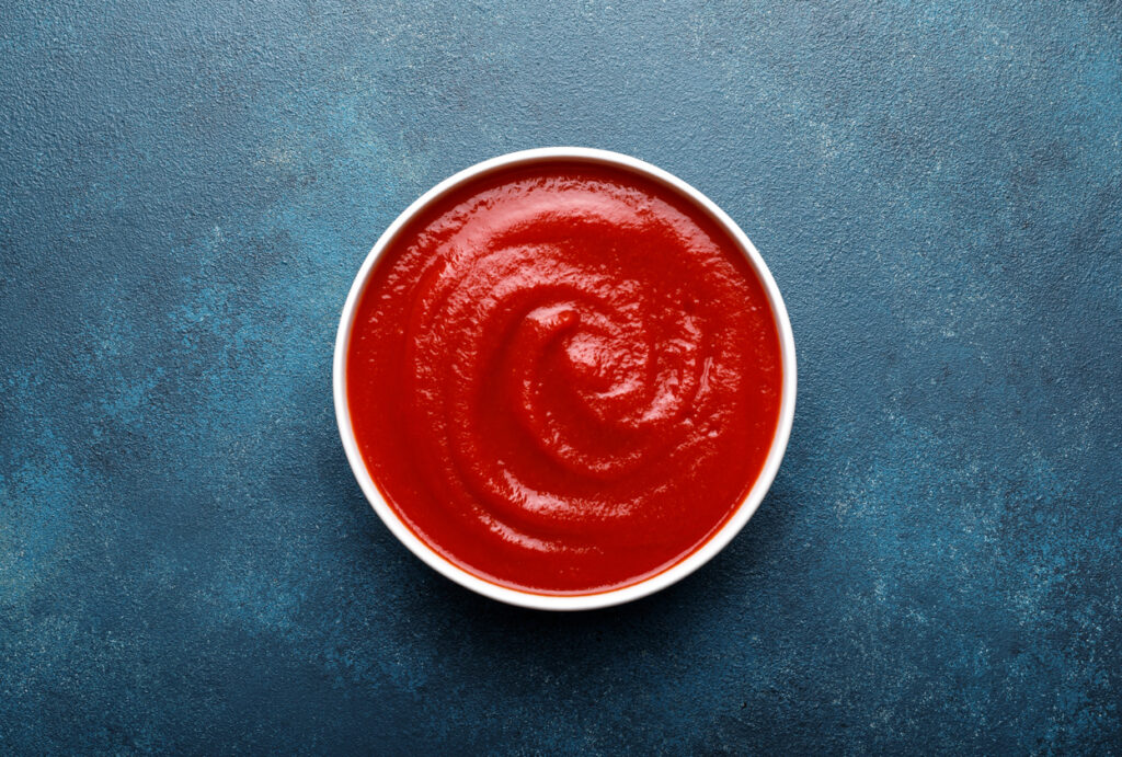 Tomato paste, sauce, ketchup with copy space , top view from foodservice suppliers
