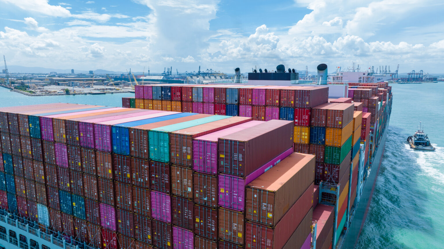 What is procurement supply chain management? Stern of large cargo container ship import export container box on the ocean sea on blue sky back ground concept transportation logistic and service to customer and supply change