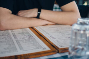 young man enjoys a meal in a Greek restaurant