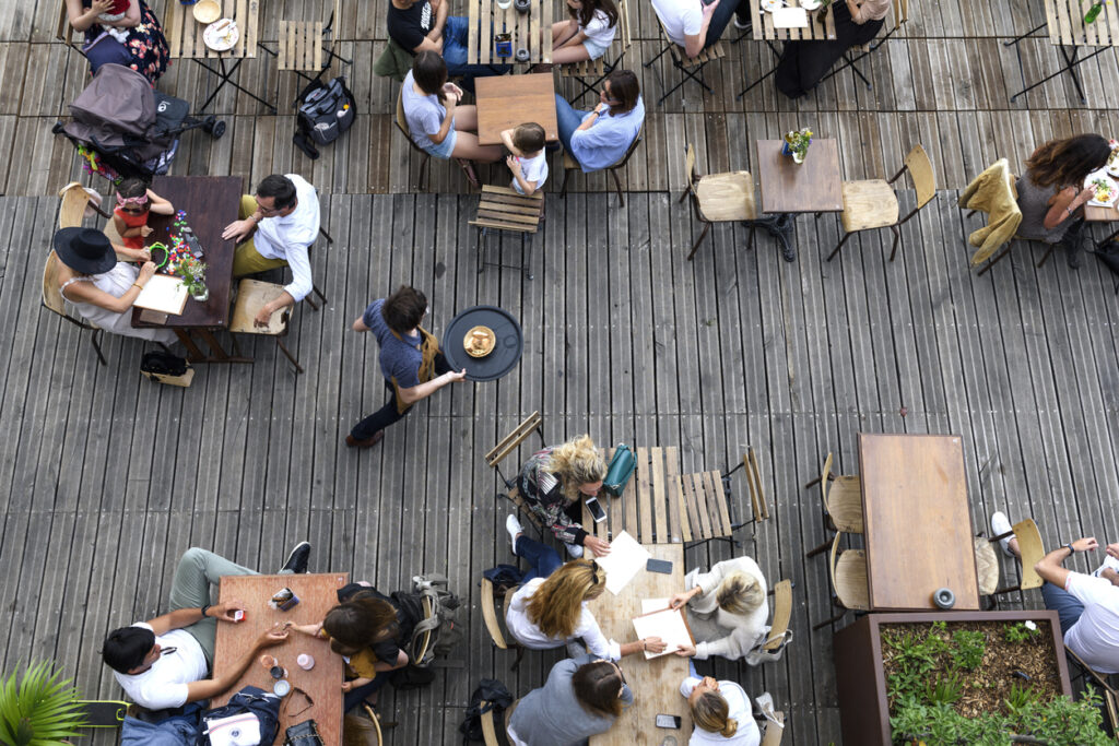 Paris, June 5, 2017 : people is having lunch in a terrace restaurant, relaxing and friendly moment, style of life. Custom contracting