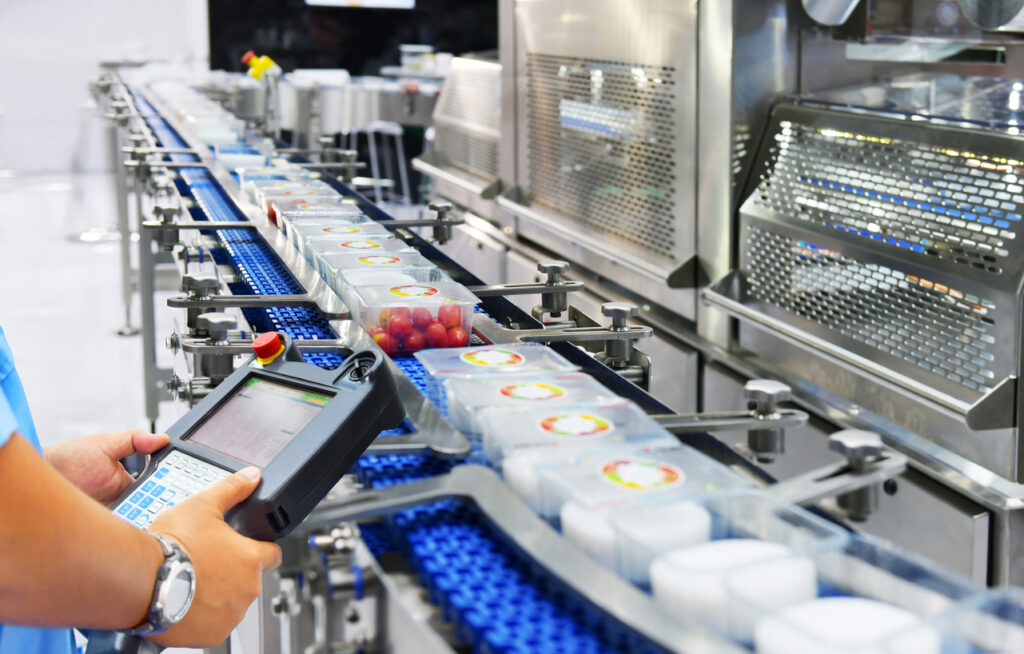 Manager check and control automation Food products box transfer on Automated conveyor systems in factory